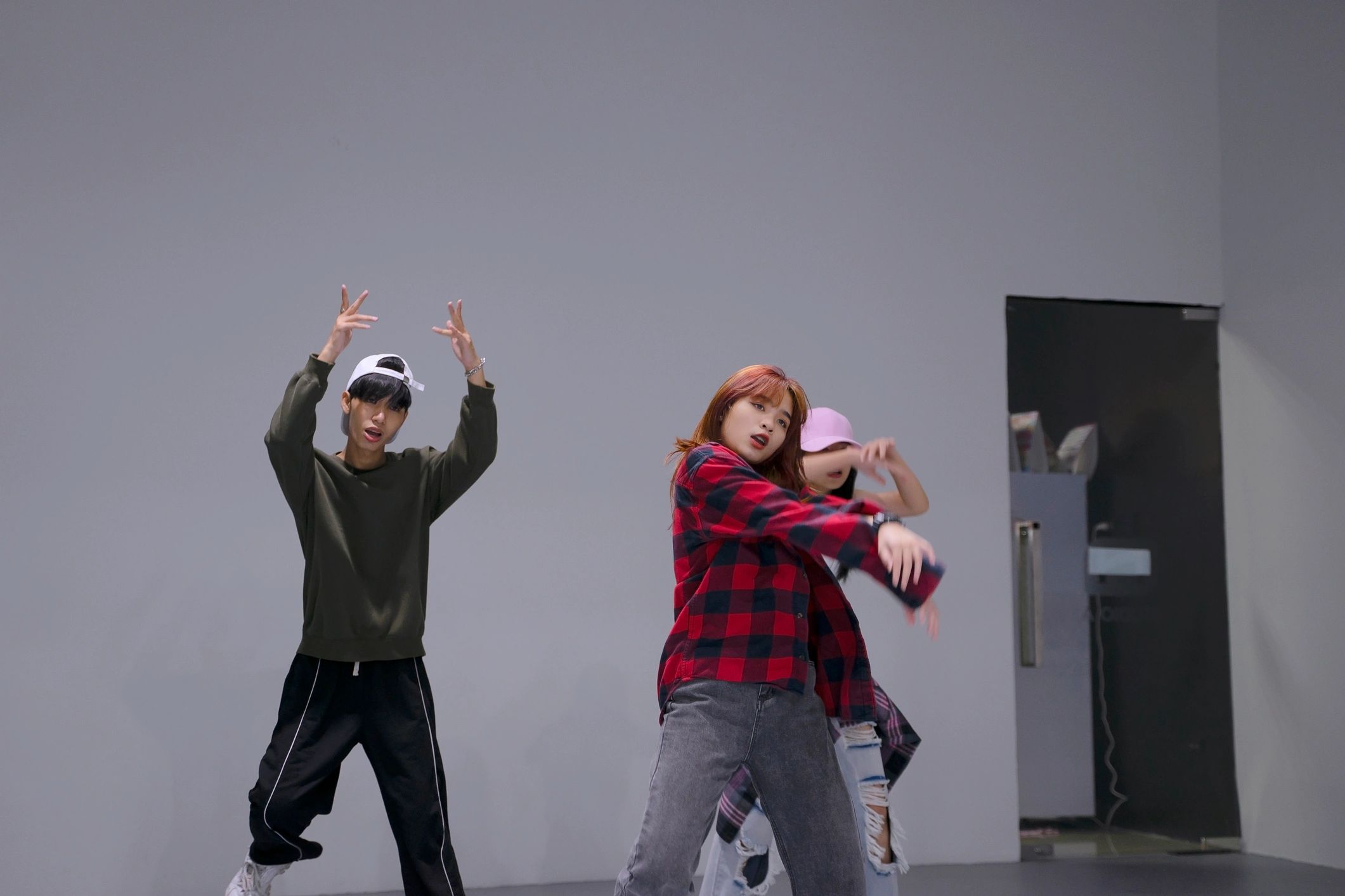 Teen dancers learning choreography in studio