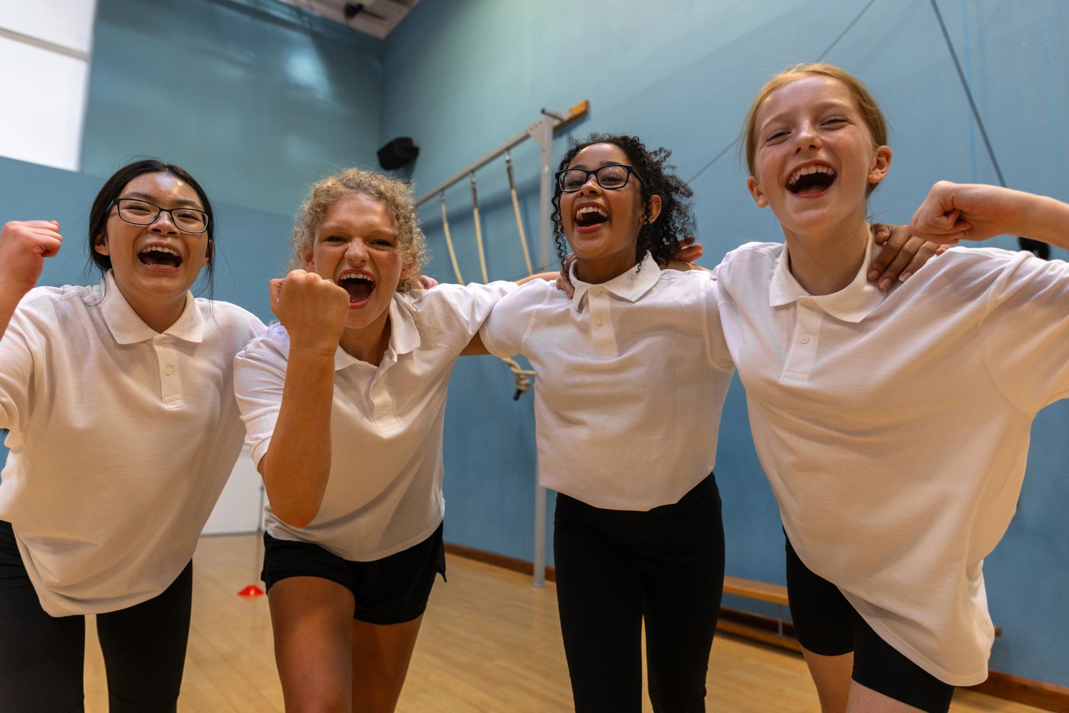 Teen dancers celebrating together after class