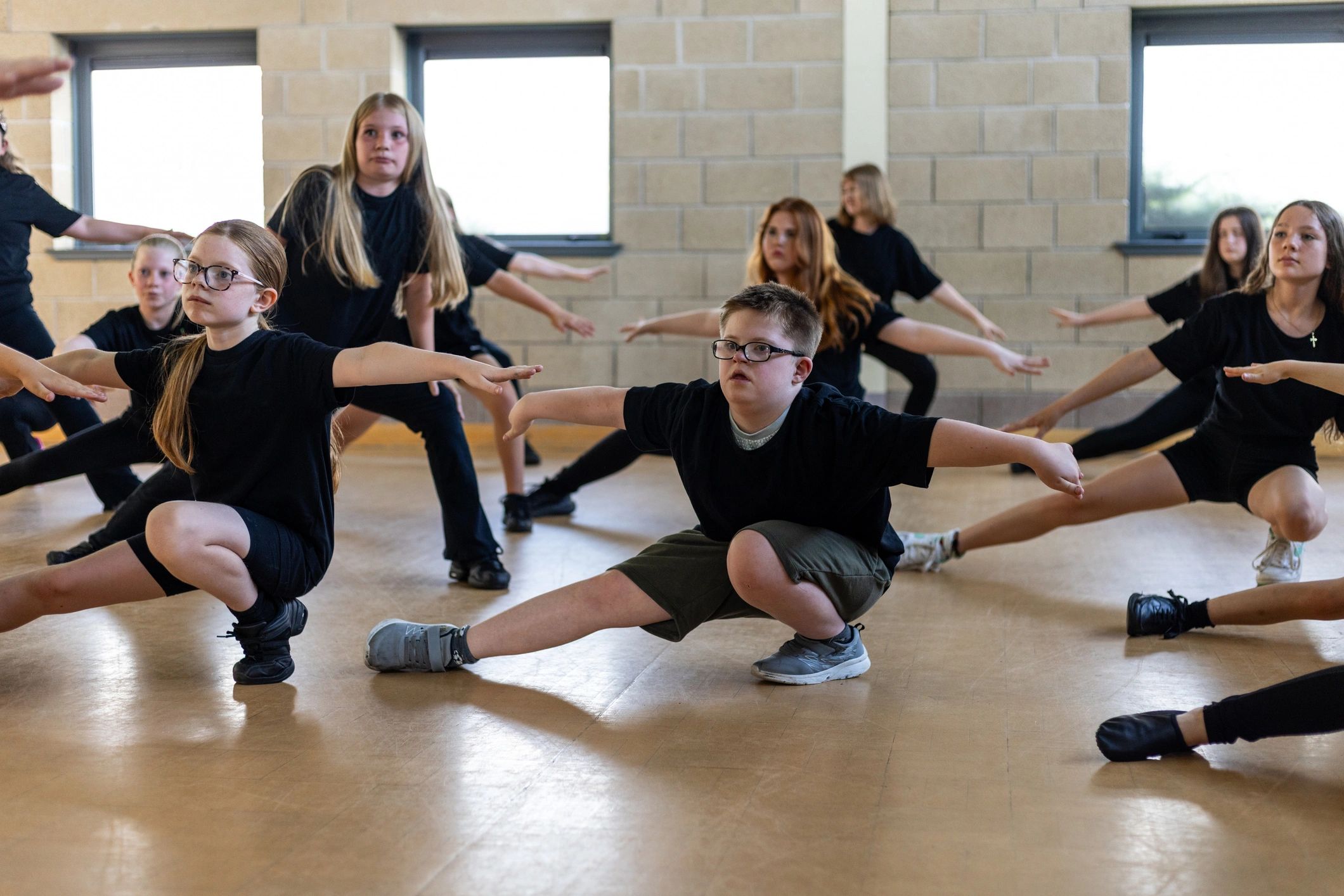 Children warming up together in a dance class